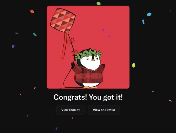 A celebratory screen featuring a cartoon penguin wearing a laurel wreath and red jacket holding a kite-shaped balloon, with confetti around and the text "Congrats! You got it!" above buttons for "View receipt" and "View on Profile."