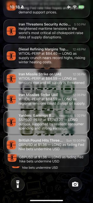 A smartphone lock screen shows financial news notifications including 'Iran Threatens Security Actio...', 'Diesel Refining Margins Top...', 'Iran Missile Strike on UAE', and 'British Pound Hits Three-...' with mentions of $SMIC and $OIL.