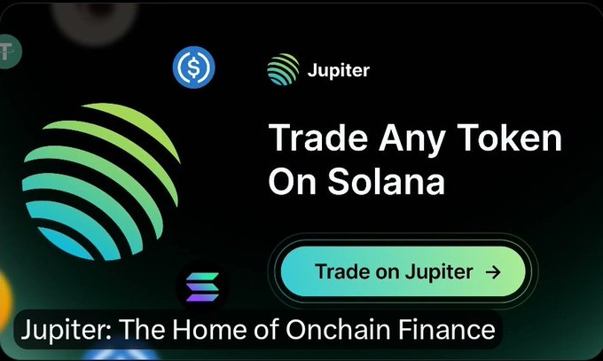 A promotional graphic featuring the Jupiter logo and the headline "Trade Any Token On Solana" with a "Trade on Jupiter" call-to-action button, captioned "Jupiter: The Home of Onchain Finance." The image serves as a backdrop for an airdrop announcement for the $ANSEM token (contract: 9cRCn9rGT8V2imeM2BaKs13yhMEais3ruM3rVrTGpump), with Jupiter/Solana branding tying the giveaway to the platform where the token can be traded.