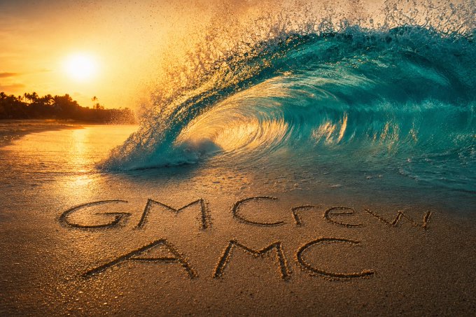 A vibrant ocean wave curls at sunset with golden light reflecting on the wet sand, where 'GMCRYPTO AMC' is written.