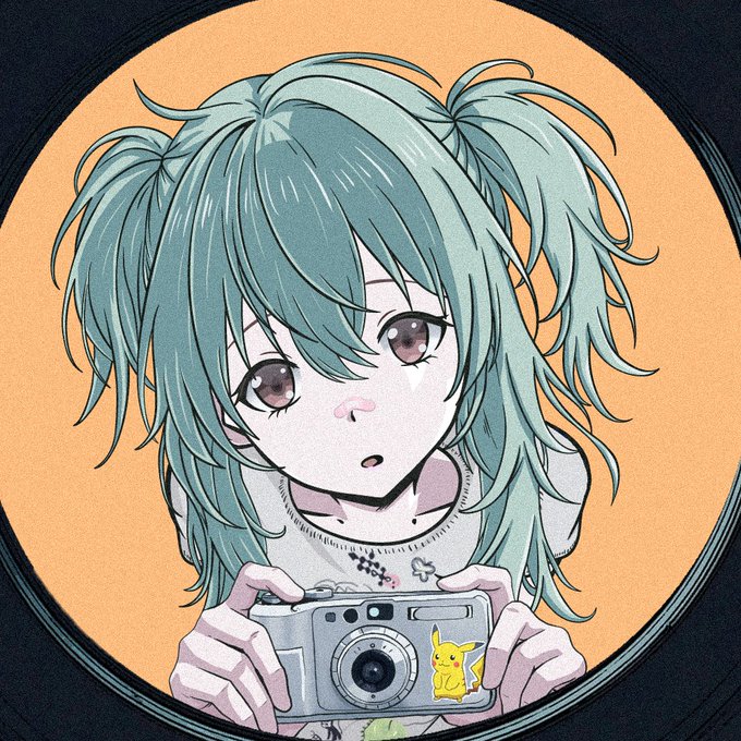 An anime-style illustration shows a girl with teal twin-tails holding a silver camera with a Pikachu sticker, set against an orange circular background.