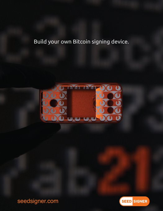 A hand holds an orange SeedSigner Bitcoin signing device adorned with eye-pattern stickers against a backdrop of blurred alphanumeric text, with the tagline "Build your own Bitcoin signing device" and "seedsigner.com" displayed. The image showcases a customized SeedSigner case in response to the post asking users to share their nicest SeedSigner case designs.
