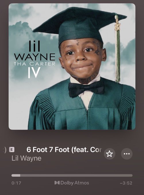 A Spotify playback screen showing the Lil Wayne 'Tha Carter IV' album cover, currently playing '6 Foot 7 Foot' at 0:17.