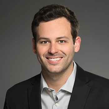 A professional headshot of a smiling man in a black suit jacket and white shirt, likely representing Ryan Rasmussen of Bitwise in connection with a quote about sovereign wealth funds purchasing Bitcoin.