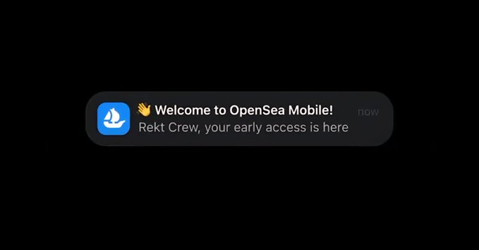 A notification on a black background reading 'Welcome to OpenSea Mobile! Rekt Crew, your early access is here' with the OpenSea sailboat logo.