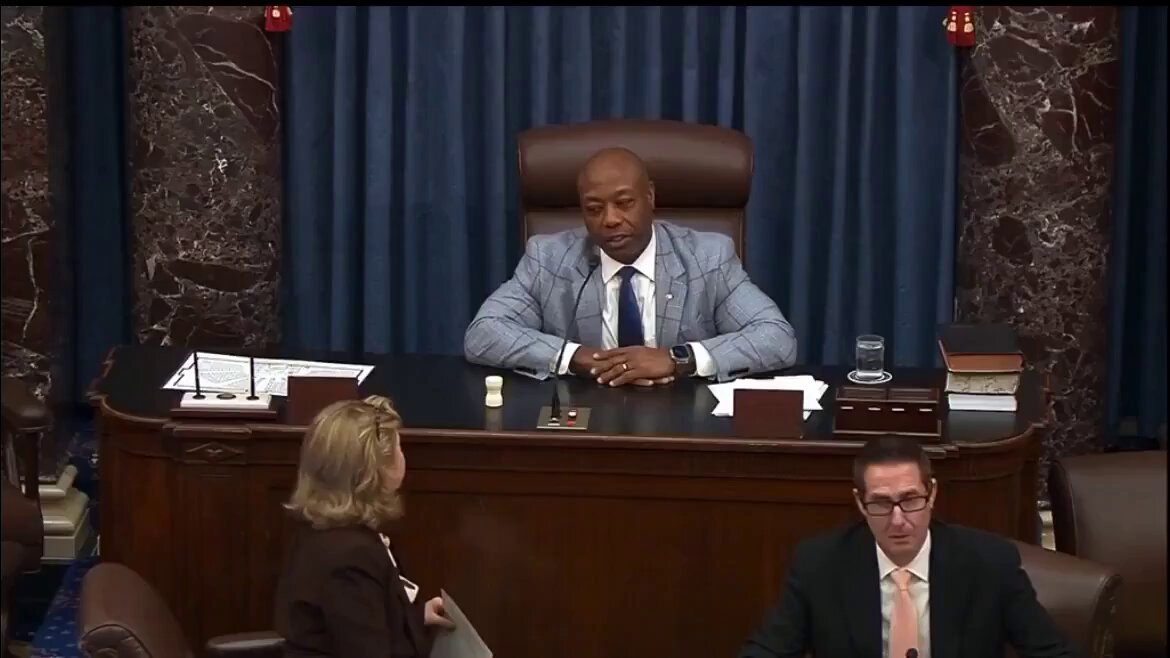 The image shows a man sitting at a desk, possibly in a courtroom or a meeting room, with two other people seated across from him. The scene appears to be related to an ongoing legal proceeding or discussion involving the creation of a central bank digital currency (CBDC). The text "BREAKING" is visible on the image, which suggests that this event has recently taken place and is now being shared by the post. The caption reads "United States Senate just released the final bill to ban the Fed from creating a CBDC untill 203", indicating that the bill was passed in Congress and will soon be implemented.
