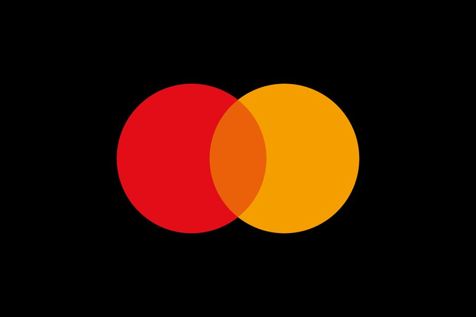 The image features a black background with two overlapping circles, one red and one yellow, positioned at the center of the frame. Below these circles, there's text that reads "Mastercard just launched 24/7 stablecoin settlement on Solana Think about the scale here. 3.7 billion cards. Over 210 countries. One of the biggest payment networks on Earth is now fully onchain." The image seems to be related to a post discussing the recent launch of Mastercard's new stablecoin settlement, which has been widely adopted by many countries around the world.