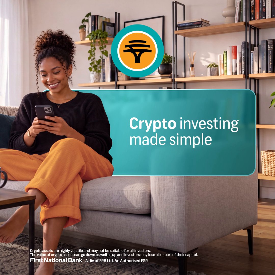 A relaxed woman smiles at her smartphone on a couch in a cozy living room, overlaid with a teal banner reading "Crypto investing made simple" and the First National Bank (FNB) logo. The image visually represents FNB's new crypto and stablecoin accessibility offering in South Africa, aligning with the post celebrating this financial inclusion milestone.