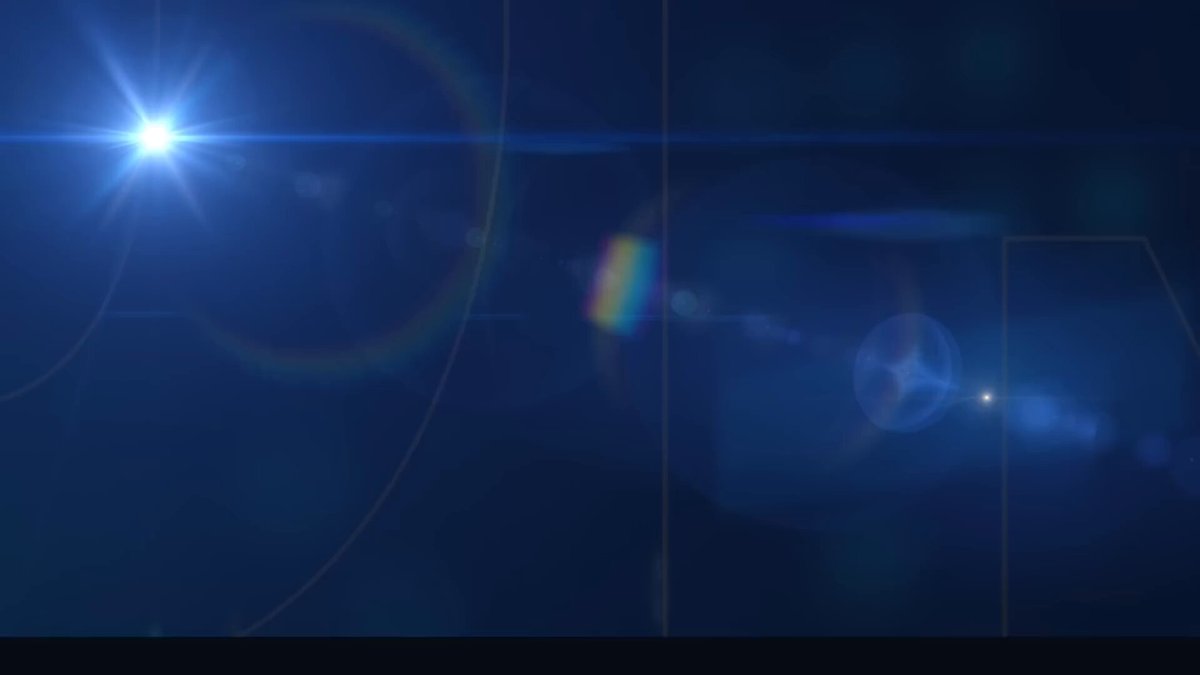 The image features a blue sky with a bright white sun shining through it. The sun's rays are focused at an angle, creating a lens flare effect that adds depth and dimension to the scene. The background of the image is dark blue, providing contrast to the bright sunlight. The text "Last Thursday on @SchwabNetwork" suggests that this image was captured during a discussion about Bitcoin pricing dynamics or digital currency.