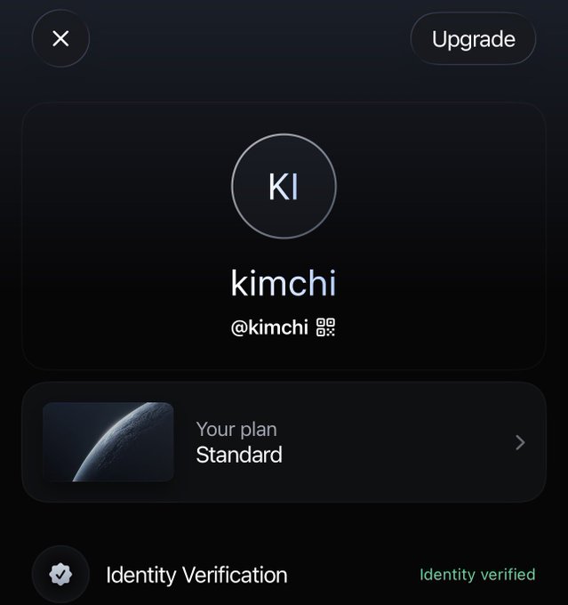 A screenshot of a dark-themed profile settings menu displays the username "kimchi" (@kimchi) with a circular "KI" avatar, alongside an "Upgrade" button, a "Standard" plan status with a planetary thumbnail, and a verified "Identity Verification" section, visually supporting the post's excitement about joining EthenaPay to spend, earn, and upgrade.