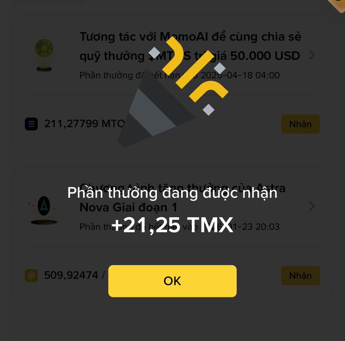A mobile app interface in Vietnamese shows an MomoAI reward claim notification, displaying a pop-up that reads 'Phần thưởng đang được nhận +21,25 TMX' with an OK button.