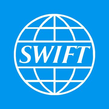 The image displays the SWIFT logo, featuring the company's name in white text across a white wireframe globe on a bright blue background. This logo relates to the news that IBM is connecting its digital-asset platform to SWIFT's blockchain ledger, as SWIFT is the global financial messaging network facilitating the tokenized bank payments being discussed.