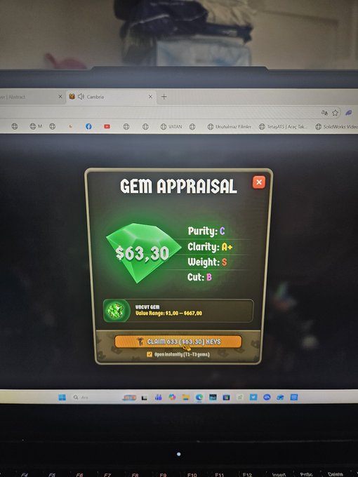 A laptop screen displays a 'GEM APPRAISAL' window showing a green Uncut Gem valued at $63.30 with stats Purity:C, Clarity:A+, Weight:S, Cut:B, and a claim button in KEYS.