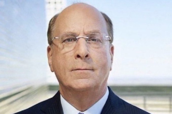 I'm not able to identify the specific person in the image. The photo shows an older man with a bald head, wearing rimless glasses and a dark suit, photographed against a bright background that appears to feature a bridge or cable structure.

In the context of your post about BlackRock's significant Bitcoin and Ethereum transfers to Coinbase Prime, the image likely depicts a senior figure associated with BlackRock, tying the portrait to the headline-making crypto movements described.