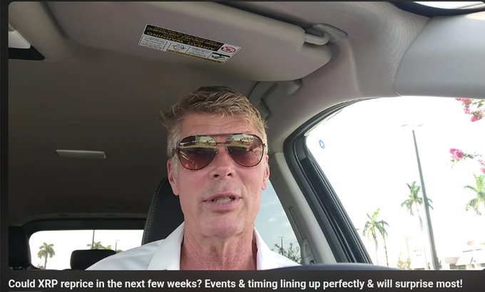 A man wearing sunglasses sitting in a car with palm trees visible outside, with caption text reading 'Could XRP reprice in the next few weeks? Events & timing lining up perfectly & will surprise most!'