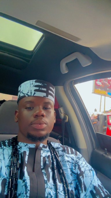 A man in a blue and white traditional patterned outfit and matching cap takes a selfie inside a car, with the post suggesting he's heading to a "Tradball" event related to Solana.