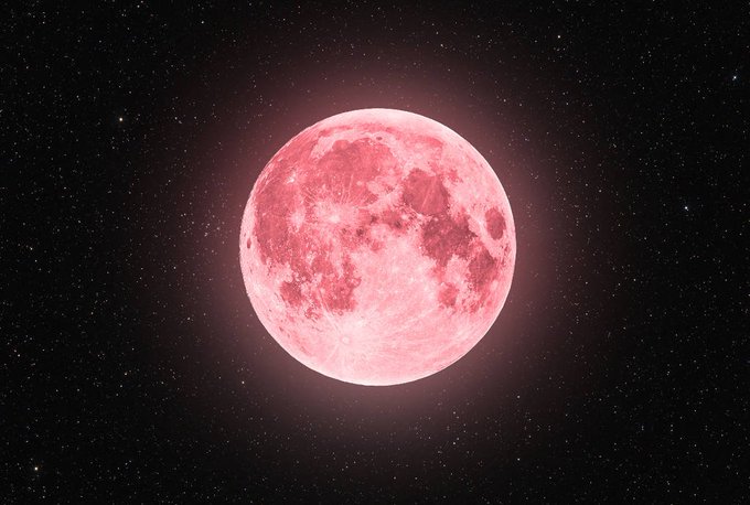 A pink full moon glows brightly against a dark, starry night sky, casting a soft rose-colored light into the surrounding space.
