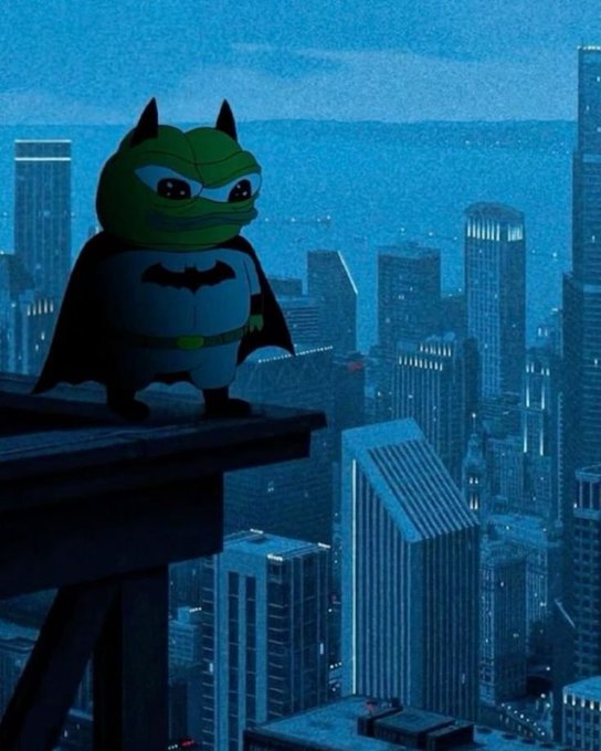 A cartoon character dressed as Batman stands on a rooftop ledge, gazing out over a blue-tinted cityscape at night.