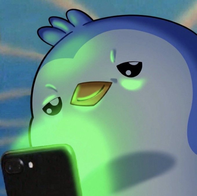 A cartoonish, glowing blue and green bird-like character holds a smartphone, its face illuminated by the screen with an angry or focused expression.