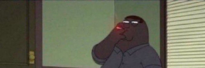 A cartoon character with dark skin and glasses standing at a doorway with a glowing red eye.
