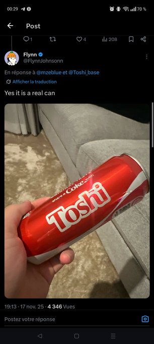 A Twitter/X post by @FlynnJohnsonn showing a hand holding a red Coke can labeled 'Toshi' with the caption 'Yes it is a real can'.