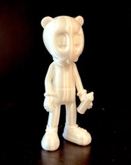 A small, white, unpainted 3D-printed figurine of a cartoon bear character standing against a black background.