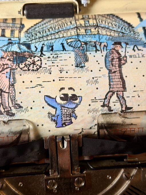 A close-up of an old typewriter feeding through paper with a whimsical illustration of figures in a rainy cityscape, including one labeled 'POET' walking with an umbrella.