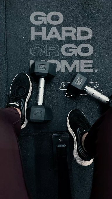 The image features a pair of legs with black sneakers and two dumbbells placed next to each other. The text "Go hard or go home" can be seen, which might be related to fitness or exercise routines. The caption also mentions that the post is about blockchain history and how it keeps growing.