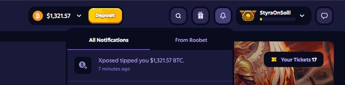 A screenshot of a Roobet gambling website showing a notification 'Xposed tipped you $1,321.57 BTC' and a balance of $1,321.57 BTC.