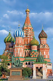 St. Basil's Cathedral stands prominently on Red Square in Moscow, its colorful onion domes rising against a blue sky. The iconic Russian landmark serves as a visual symbol connecting to the post about Russia's Central Bank unveiling new draft directives for Bitcoin and cryptocurrency margin trading rules.