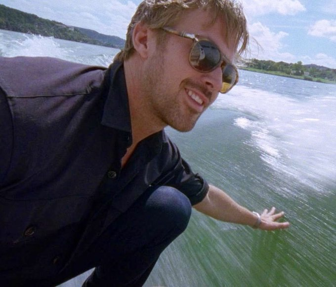 The image features a man wearing sunglasses, riding a surfboard on a body of water. The photo has been edited with a filter that makes him appear as if he's floating or surfing on air. The caption reads "GM CT Ensure presence on @TheARCTERMINAL x @quipnetwork x @useTria Nobody cares until you make it". This means the image is likely meant to be shared and promote a sense of freedom, adventure, or relaxation associated with surfing.