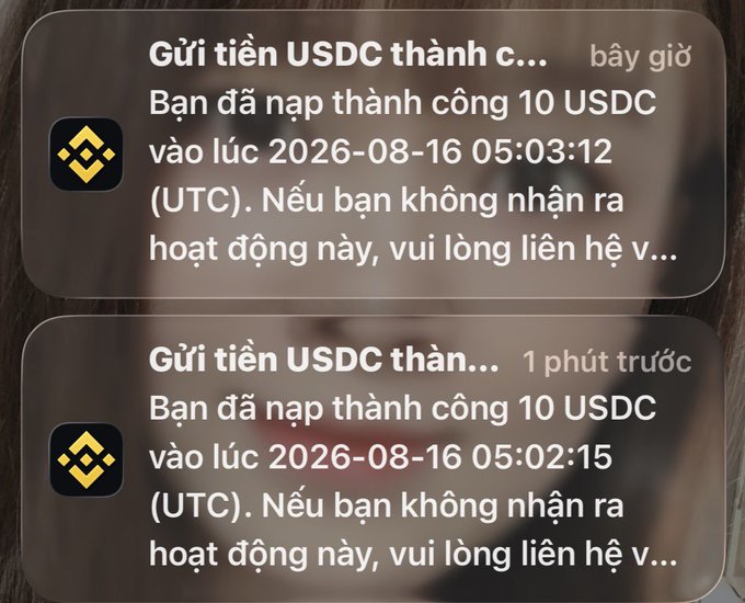Two Binance notifications in Vietnamese showing successful USDC deposits of 10 USDC, with timestamps '2026-08-16 05:03:12' and '2026-08-16 05:02:15 (UTC)', overlaid on a blurry image.