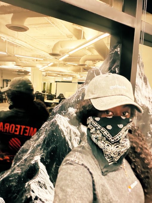 A masked person in a "good vibes" cap and bandana poses for a mirror selfie inside an office space, while a reflection shows another person wearing a "METEORA" branded shirt—visually reinforcing the post's playful "3 wolves" metaphor about Meteora's role in liquidity providers, liquidity pools, and launchpads.