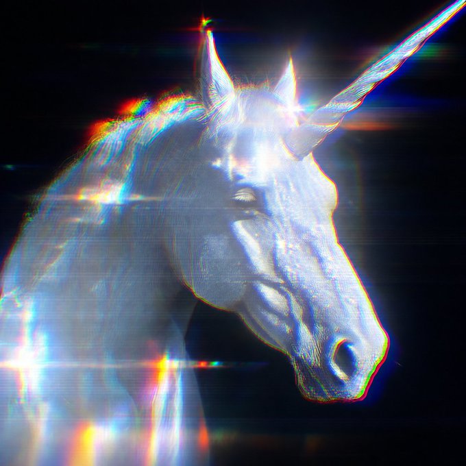 A stylized digital artwork of a white unicorn head with a spiral horn, featuring prominent chromatic aberration and rainbow lens flare effects against a dark background.