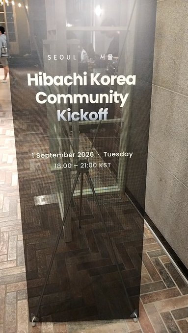 A black sign displays 'SEOUL 서울 Hibachi Korea Community Kickoff, 1 September 2026 · Tuesday, 18:00 - 21:00 KST'.