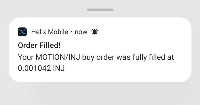 A mobile notification from Helix Mobile stating 'Order Filled! Your MOTION/INJ buy order was fully filled at 0.001042 INJ'.