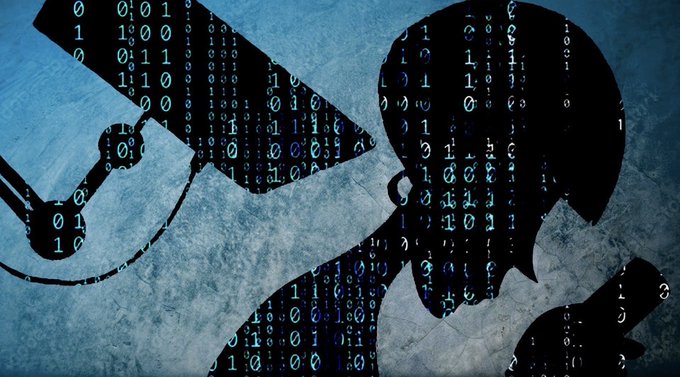 A stylized graphic features the silhouette of a hacker in a hoodie working on a laptop, filled with cascading green binary code against a textured blue background.
