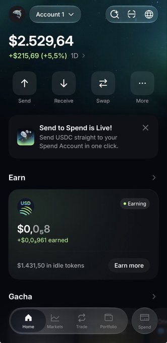 A screenshot of the Jupiter Mobile crypto wallet app showing a $2,529.64 balance (up $215.69, +5.5% in 1D) with options to Send, Receive, Swap, and earn on idle tokens worth $1,431.50. The image illustrates the post's message about using Jupiter Mobile as a permissionless alternative to traditional banking, highlighting features like spending, investing across assets, and earning on idle funds.