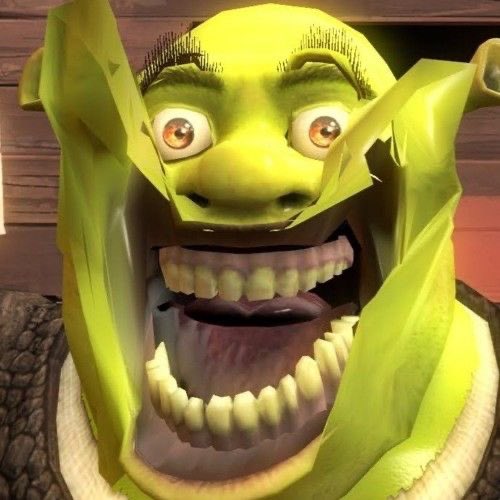 A close-up of the green ogre character Shrek with a wide, exaggerated mouth full of large teeth and wide eyes, appearing to be in a state of shock or screaming.