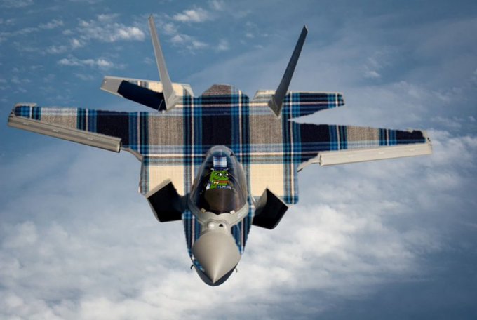 An image of a fighter jet flying in the sky, digitally edited to appear as if it's wearing a blue and white plaid button-up shirt.