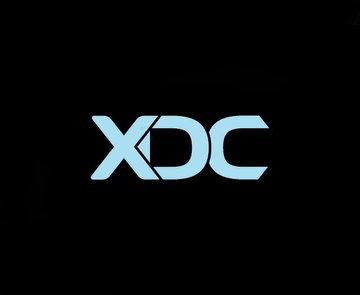 The XDC logo rendered in light blue against a solid black background.