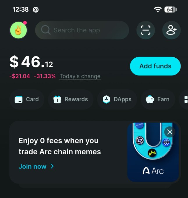 A mobile crypto wallet app interface showing a balance of $46.12 with a -31.33% daily decline, featuring navigation options for Card, Rewards, DApps, Earn, and a promotional banner for '0 fees when you trade Arc chain memos'.