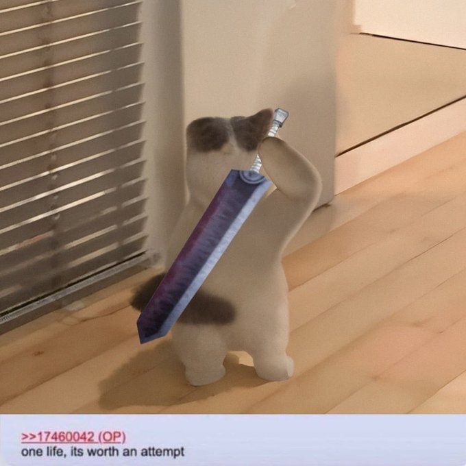 A small figurine of a black-and-white cat stands on a wooden floor holding a large sword, with the caption ">>17460042 (OP) one life, its worth an attempt" displayed below.