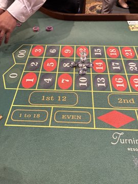A roulette betting layout at Turning Stone Resort Casino, where the player has placed a stack of chips on a winning bet, celebrating their first bet turning $500 into $10.3K as mentioned in the accompanying promotional post.