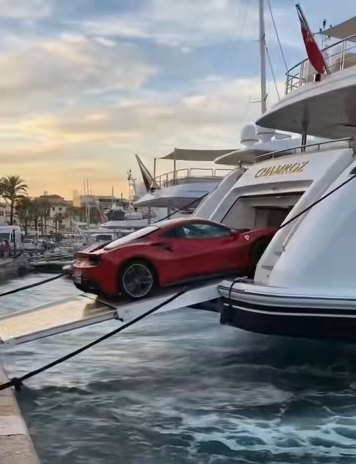 The image features a red sports car being towed into a boat by a ramp, with several other boats visible in the background. The scene also includes a caption that reads "When my crypto holdings become ridiculous high I'm telling nobody but there will be signs @MetalBlockchain @MetricalusTDBN @XPRNetwork @LOAN_Protocol @MarshallHayner". This suggests that the image is related to cryptocurrency or digital assets, possibly as part of a promotional campaign for a new cryptocurrency or an advertisement for a company offering services related to crypto management.

The caption also mentions "loan protocol" and "metalblockchain", which could be related to the concept of peer-to-peer lending platforms or blockchain technology used in cryptocurrencies like Bitcoin. The image might be promoting these services, highlighting their benefits, or simply showcasing a unique aspect of the cryptocurrency world.