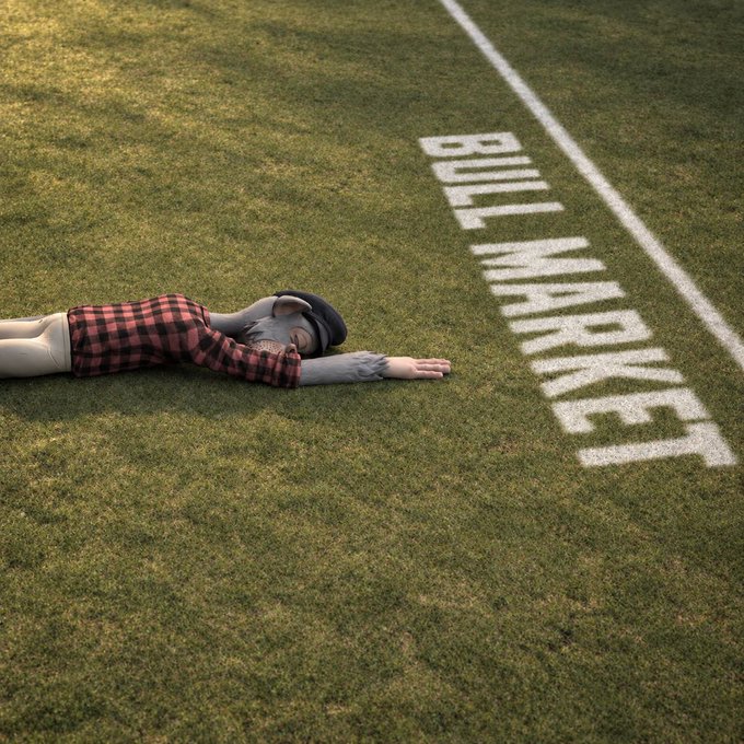 A 3D-rendered figure in a red and black checkered shirt and beret lying face-down on a football field next to white painted text reading 'BUILT IN HURRY'.