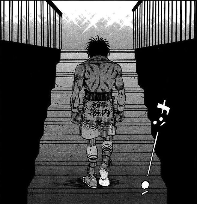 Black-and-white manga panel showing a muscular boxer from behind, walking up a staircase toward a bright arena, wearing shorts with Japanese text '帯之内 釣船'.
