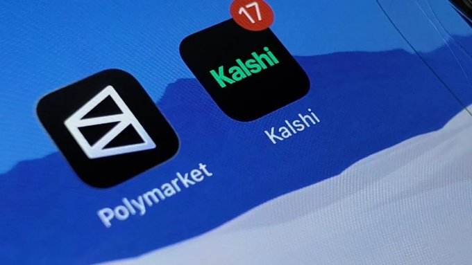 A close-up photo of a phone screen displaying the app icons for Polymarket and Kalshi (with a notification badge showing 17), two prediction market platforms.