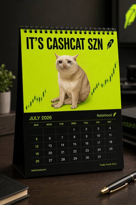 A Robinhood-branded July 2026 desk calendar titled "IT'S CASHCAT SZN" features a cream-colored cat surrounded by bullish green stock chart candlesticks, tying into the post's optimistic "bullish on the green chain" sentiment about seizing opportunity anytime.