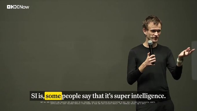 Ethereum co-founder Vitalik Buterin speaks onstage at the OKX Now event, holding a microphone and gesturing while discussing that "SI is some people say that it's super intelligence." The image aligns with the post's context of Buterin discussing hardware security, though the visible subtitle touches on AI superintelligence rather than the "not your silicon, not your keys" theme referenced in the caption.